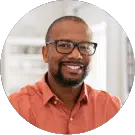 a black man with beards and mustache and black glass